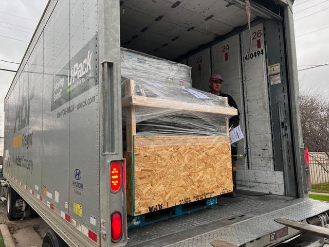 Custom crating and packaging services in Fort Worth for shipping cargo in a freight truck