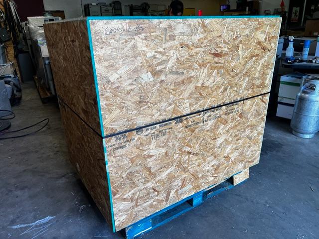 Industrial pallets staged for packaging and shipping operations at AA&D Crating facility