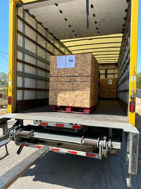 Parker Maritime Technologies wood crate on flatbed showcasing custom crating and shipping services in Fort Worth