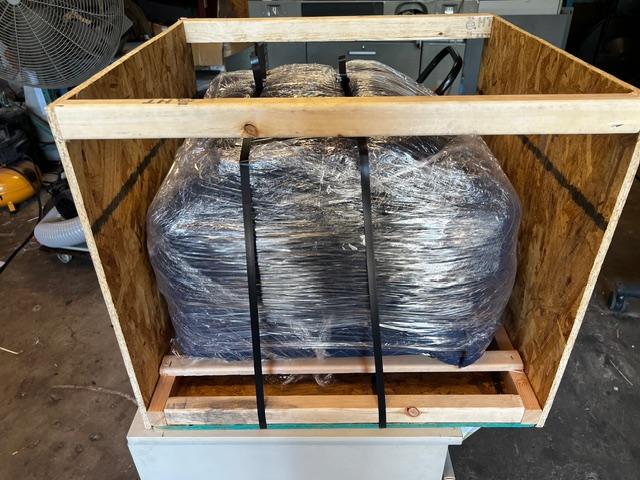 Parker Maritime Technologies wood crate on flatbed showcasing custom crating and shipping services in Fort Worth