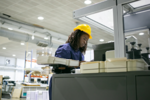 industrial-forklift-machine-lifting-palette-full-cardboard-boxes-placing-them-shelves-distribution-warehouse-facility 1 Fort Worth custom crating and packaging services for secure industrial and commercial shipments