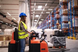 woman-warehouse-worker-operating-forklift-machine-large-distribution-warehouse-center 1 (2) AA&D Crating - Custom crating and packaging services in Fort Worth for heavy-duty industrial cargo